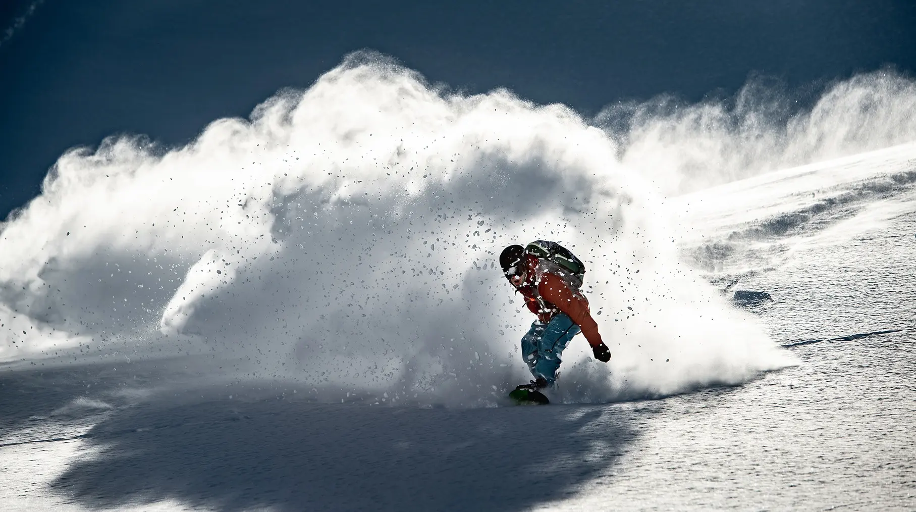 Penguin freeride snowboarder powder action